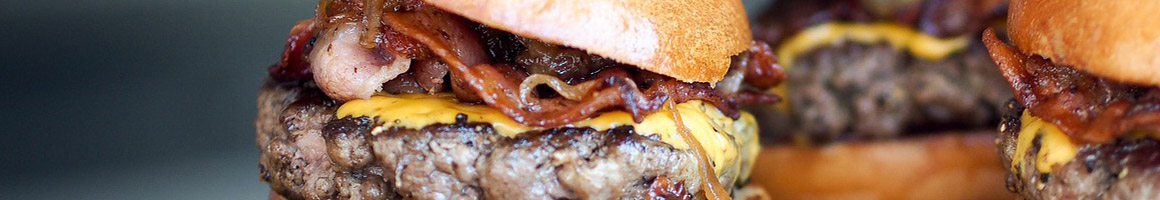 Eating Burger Fast Food at Milo's Hamburgers restaurant in Gardendale, AL.